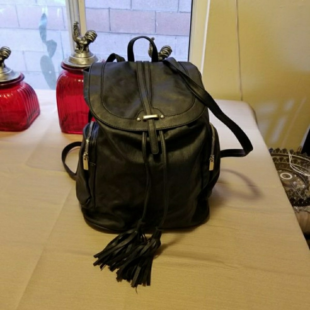 Used black small/medium stylish back pack purse